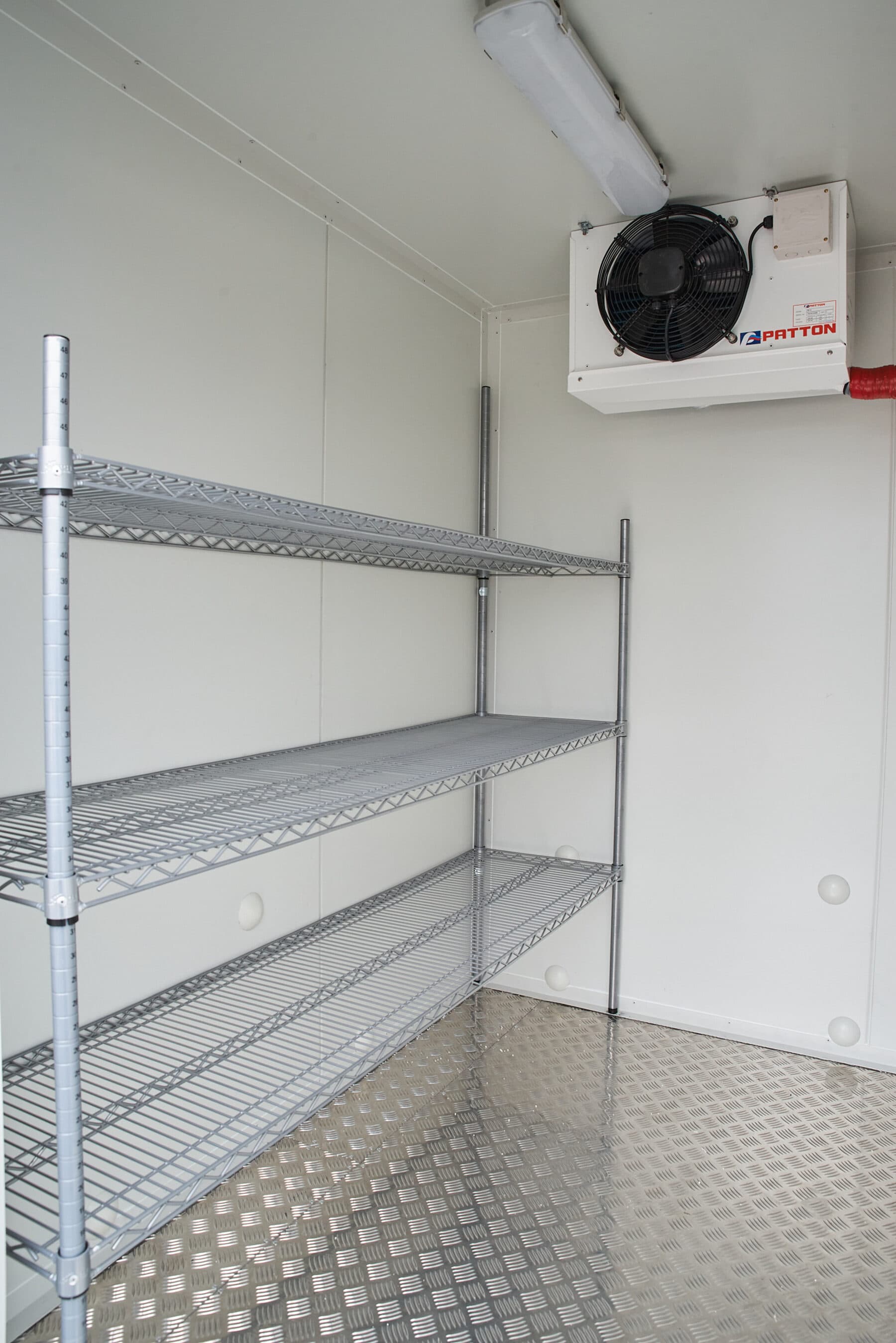 Wire shelving inside a Southern Cool Room Hire cool room trailer