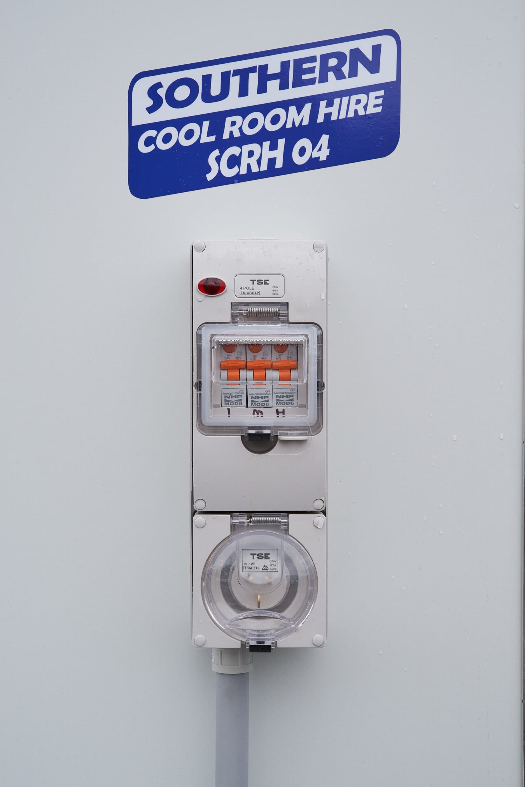The external 10 amp power inlet and switch on a trailer